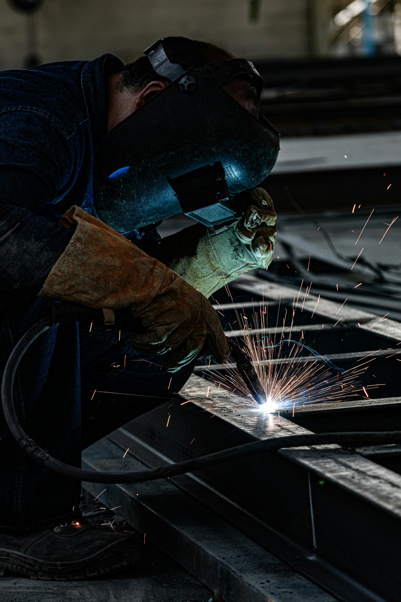 Welder fabricating a custom metal piece